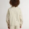 Kids’ beige jacket with multicolor splashes