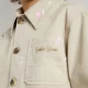 Kids’ beige jacket with multicolor splashes