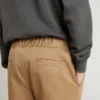 Kids’ chinos in tobacco-colored cotton