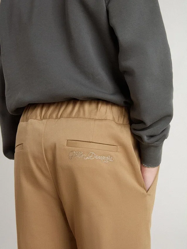 Kids’ chinos in tobacco-colored cotton