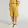 Kids jogging shorts in ochre yellow with embroidery