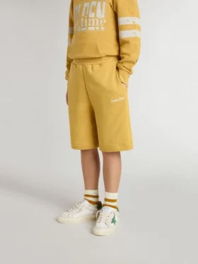 Kids jogging shorts in ochre yellow with embroidery