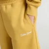 Kids jogging shorts in ochre yellow with embroidery