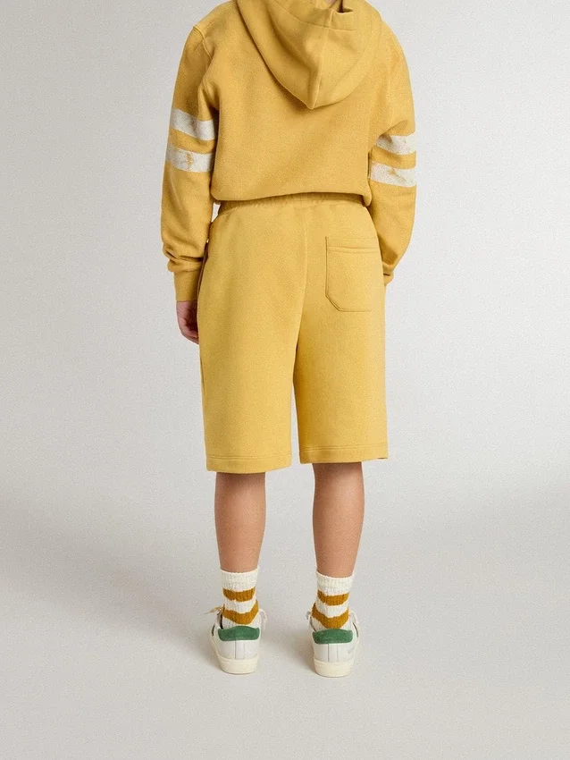 Kids jogging shorts in ochre yellow with embroidery