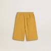 Kids jogging shorts in ochre yellow with embroidery