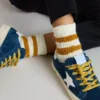 Kids’ white socks with tobacco-colored stripes