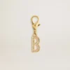 Letter B charm in gold-colored brass with crystals