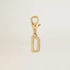 Letter D charm in gold-colored brass with crystals