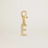Letter E charm in gold-colored brass with crystals