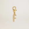 Letter F charm in gold-colored brass with crystals