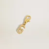 Letter G charm in gold-colored brass with crystals