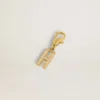 Letter H charm in gold-colored brass with crystals