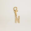 Letter N charm in gold-colored brass with crystals