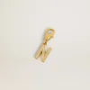Letter N charm in gold-colored brass with crystals