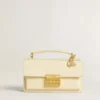Letter Q charm in gold-colored brass with crystals