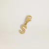Letter S charm in gold-colored brass with crystals