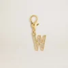 Letter W charm in gold-colored brass with crystals
