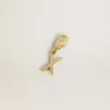 Letter X charm in gold-colored brass with crystals