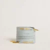 Light-blue cotton laces with contrasting gold-colored logo