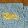 Light blue ribbed socks with brown details and yellow logo