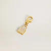 Lock-shaped charm in gold-colored brass with crystals