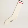 Long ribbed socks in vintage white with two-tone stripes