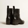 Low Debbie boots in black snake-print leather
