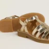 Maxime Young sandals in gold leather
