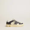 May Young in white and blue leather with leather star and heel tab