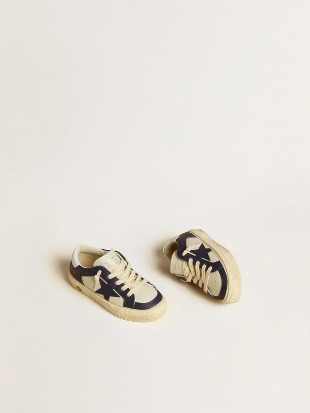 May Young in white and blue leather with leather star and heel tab
