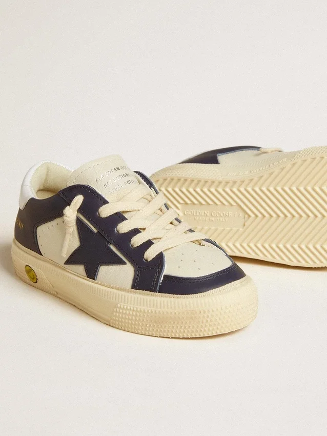 May Young in white and blue leather with leather star and heel tab