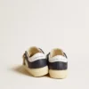 May Young in white and blue leather with leather star and heel tab