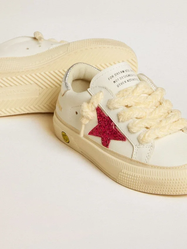 May Young with fuchsia glitter star and metallic leather heel tab