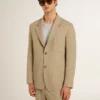 Men's beige pinstripe single-breasted jacket with an oversized fit