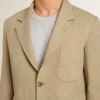 Men's beige pinstripe single-breasted jacket with an oversized fit