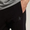 Men's black joggers with star on the front