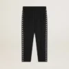 Men's black joggers with white stars on the sides