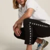 Men's black joggers with white stars on the sides