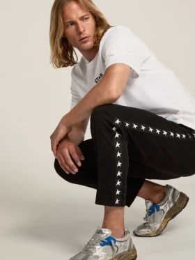 Men’s black joggers with white stars on the sides