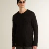 Men's black wool sweater with a distressed effect