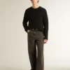 Men's black wool sweater with a distressed effect