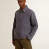 Men's blue jacket in denim cotton with distressed treatment