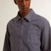 Men's blue jacket in denim cotton with distressed treatment