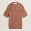 Men's brick-colored polo with embroidered logo.