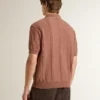 Men's brick-colored polo with embroidered logo.