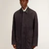 Men's denim jacket with distressed details and leather collar