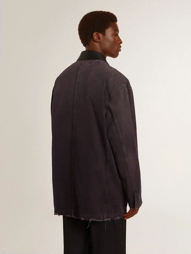 Men's denim jacket with distressed details and leather collar