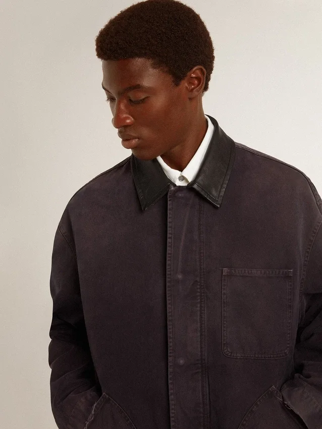 Men's denim jacket with distressed details and leather collar