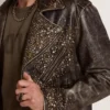 Men's leather biker jacket with hammered studs and adhesive tape
