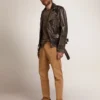 Men's leather biker jacket with hammered studs and adhesive tape